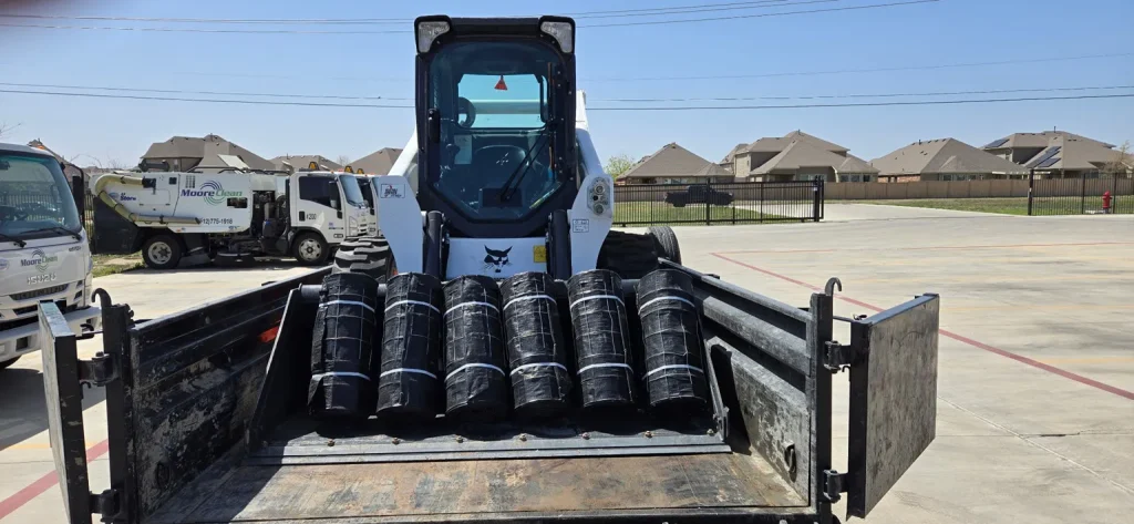 erosion control silt sheets and bobcat tractor